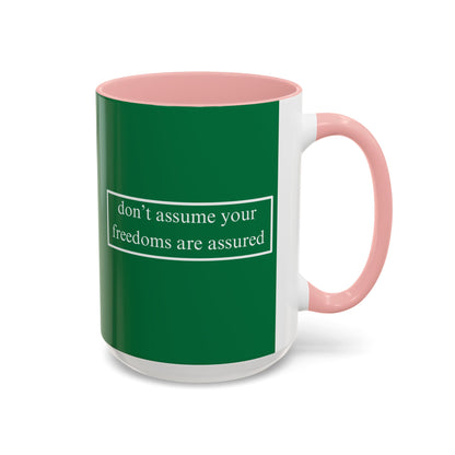 don't assume your freedoms are assured White font Green Accent Mug by theGreenDragonTavern.shop