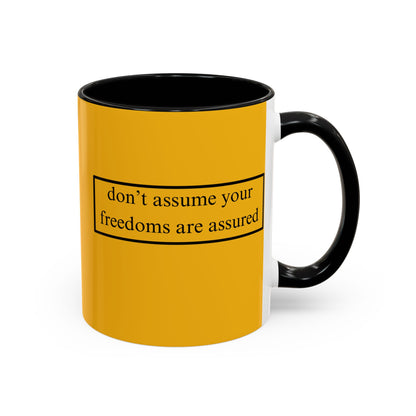 don't assume your freedoms are assured Black font Yellow Accent Mug by theGreenDragonTavern.shop