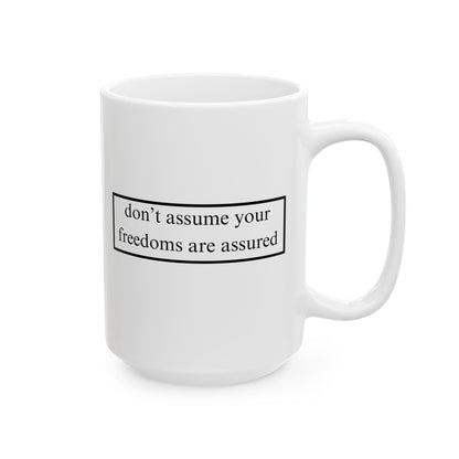 don't assume your freedoms are assured Black font White Mug by theGreenDragonTavern.shop