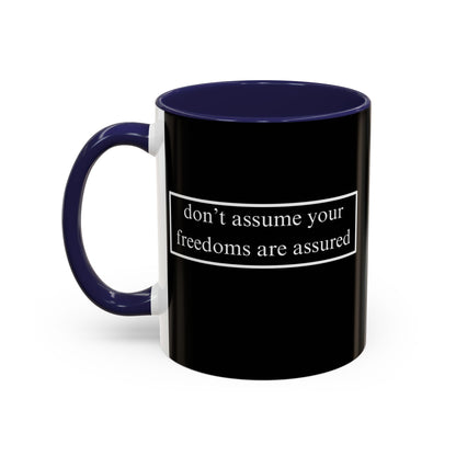 don't assume your freedoms are assured White font Black Accent Mug by theGreenDragonTavern.shop