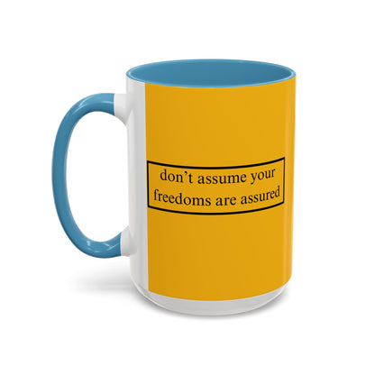 don't assume your freedoms are assured Black font Yellow Accent Mug by theGreenDragonTavern.shop