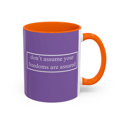 don't assume your freedoms are assured White font Light Purple Accent Mug by theGreenDragonTavern.shop