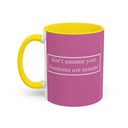 don't assume your freedoms are assured White font Pink Accent Mug by theGreenDragonTavern.shop