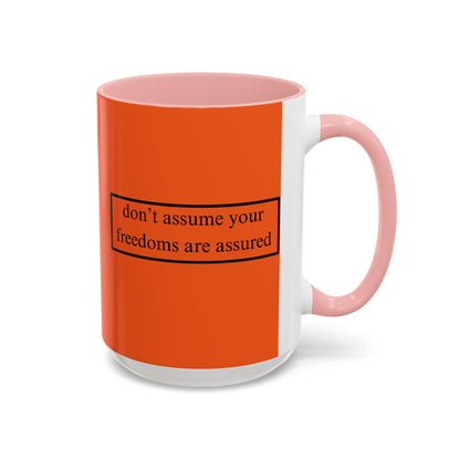 don't assume your freedoms are assured Black font Orange Accent Mug by theGreenDragonTavern.shop