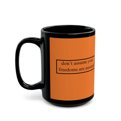 don't assume your freedoms are assured Black font Orange Mug by theGreenDragonTavern.shop