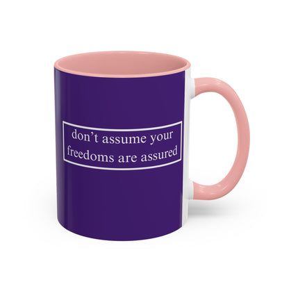 don't assume your freedoms are assured White font Dark Purple Accent Mug by theGreenDragonTavern.shop