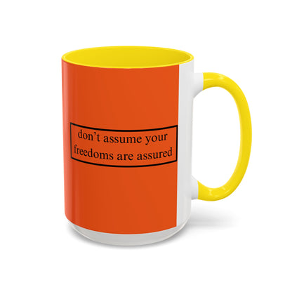 don't assume your freedoms are assured Black font Orange Accent Mug by theGreenDragonTavern.shop