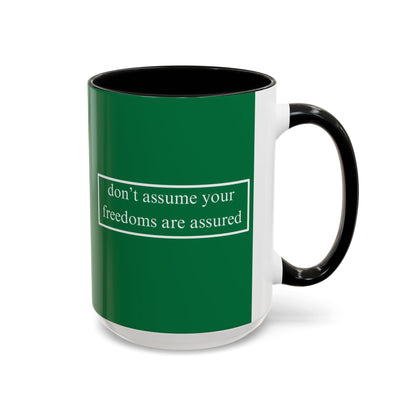 don't assume your freedoms are assured White font Green Accent Mug by theGreenDragonTavern.shop