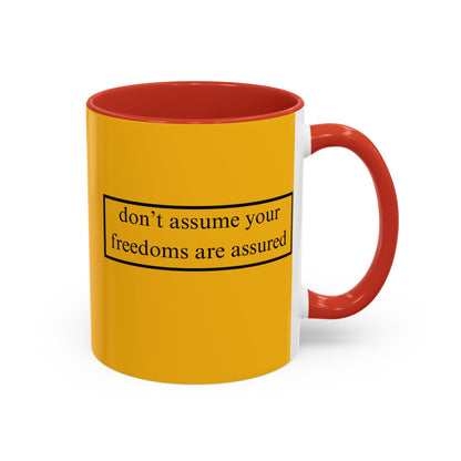 don't assume your freedoms are assured Black font Yellow Accent Mug by theGreenDragonTavern.shop