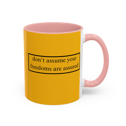 don't assume your freedoms are assured Black font Yellow Accent Mug by theGreenDragonTavern.shop