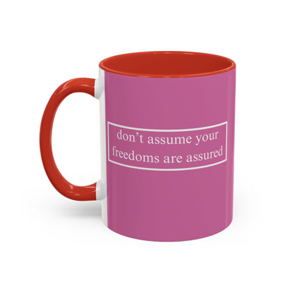 don't assume your freedoms are assured White font Pink Accent Mug by theGreenDragonTavern.shop