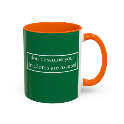 don't assume your freedoms are assured White font Green Accent Mug by theGreenDragonTavern.shop