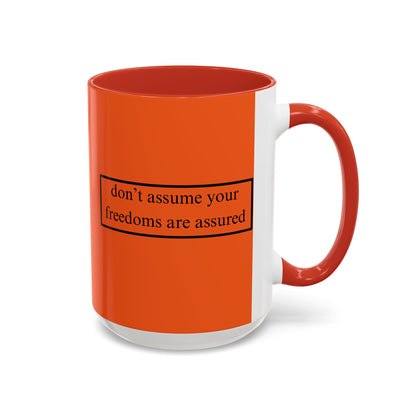 don't assume your freedoms are assured Black font Orange Accent Mug by theGreenDragonTavern.shop