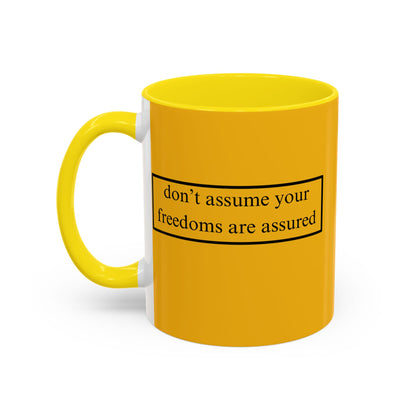 don't assume your freedoms are assured Black font Yellow Accent Mug by theGreenDragonTavern.shop