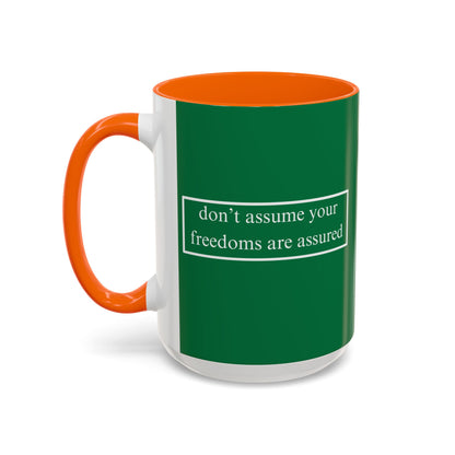 don't assume your freedoms are assured White font Green Accent Mug by theGreenDragonTavern.shop
