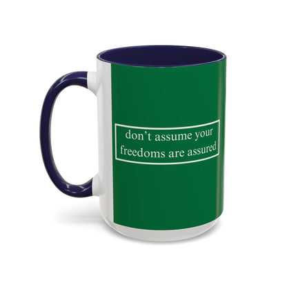 don't assume your freedoms are assured White font Green Accent Mug by theGreenDragonTavern.shop