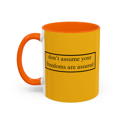 don't assume your freedoms are assured Black font Yellow Accent Mug by theGreenDragonTavern.shop