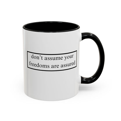 don't assume your freedoms are assured Black font White Accent Mug by theGreenDragonTavern.shop