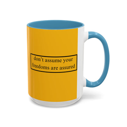 don't assume your freedoms are assured Black font Yellow Accent Mug by theGreenDragonTavern.shop