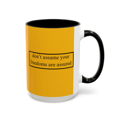don't assume your freedoms are assured Black font Yellow Accent Mug by theGreenDragonTavern.shop