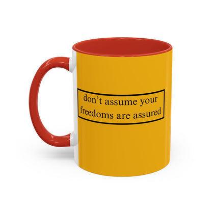 don't assume your freedoms are assured Black font Yellow Accent Mug by theGreenDragonTavern.shop