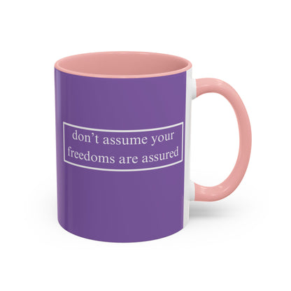 don't assume your freedoms are assured White font Light Purple Accent Mug by theGreenDragonTavern.shop