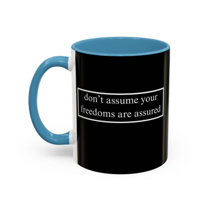don't assume your freedoms are assured White font Black Accent Mug by theGreenDragonTavern.shop