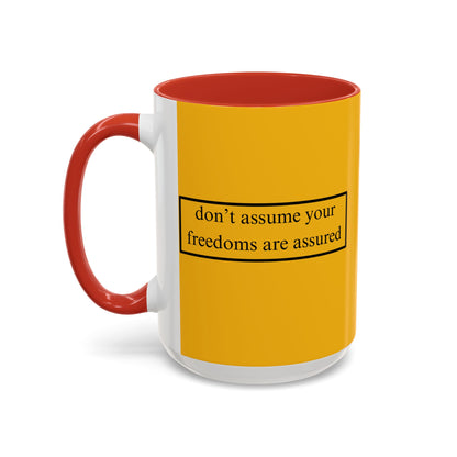 don't assume your freedoms are assured Black font Yellow Accent Mug by theGreenDragonTavern.shop