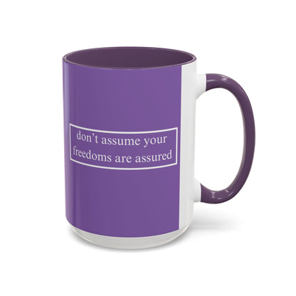 don't assume your freedoms are assured White font Light Purple Accent Mug by theGreenDragonTavern.shop