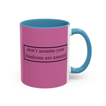 don't assume your freedoms are assured Black font Pink Accent Mug by theGreenDragonTavern.shop