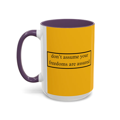don't assume your freedoms are assured Black font Yellow Accent Mug by theGreenDragonTavern.shop