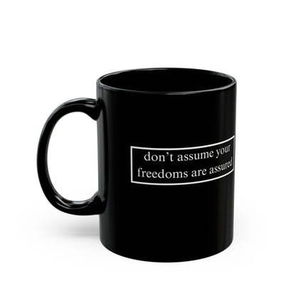 don't assume your freedoms are assured White font Black Mug by theGreenDragonTavern.shop