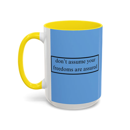 don't assume your freedoms are assured Black font Light Blue Accent Mug by theGreenDragonTavern.shop