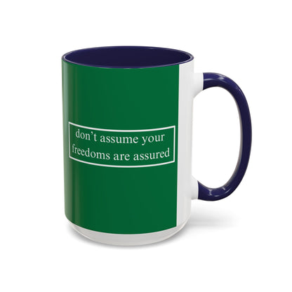 don't assume your freedoms are assured White font Green Accent Mug by theGreenDragonTavern.shop