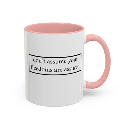 don't assume your freedoms are assured Black font White Accent Mug by theGreenDragonTavern.shop