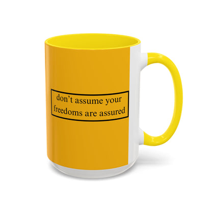 don't assume your freedoms are assured Black font Yellow Accent Mug by theGreenDragonTavern.shop