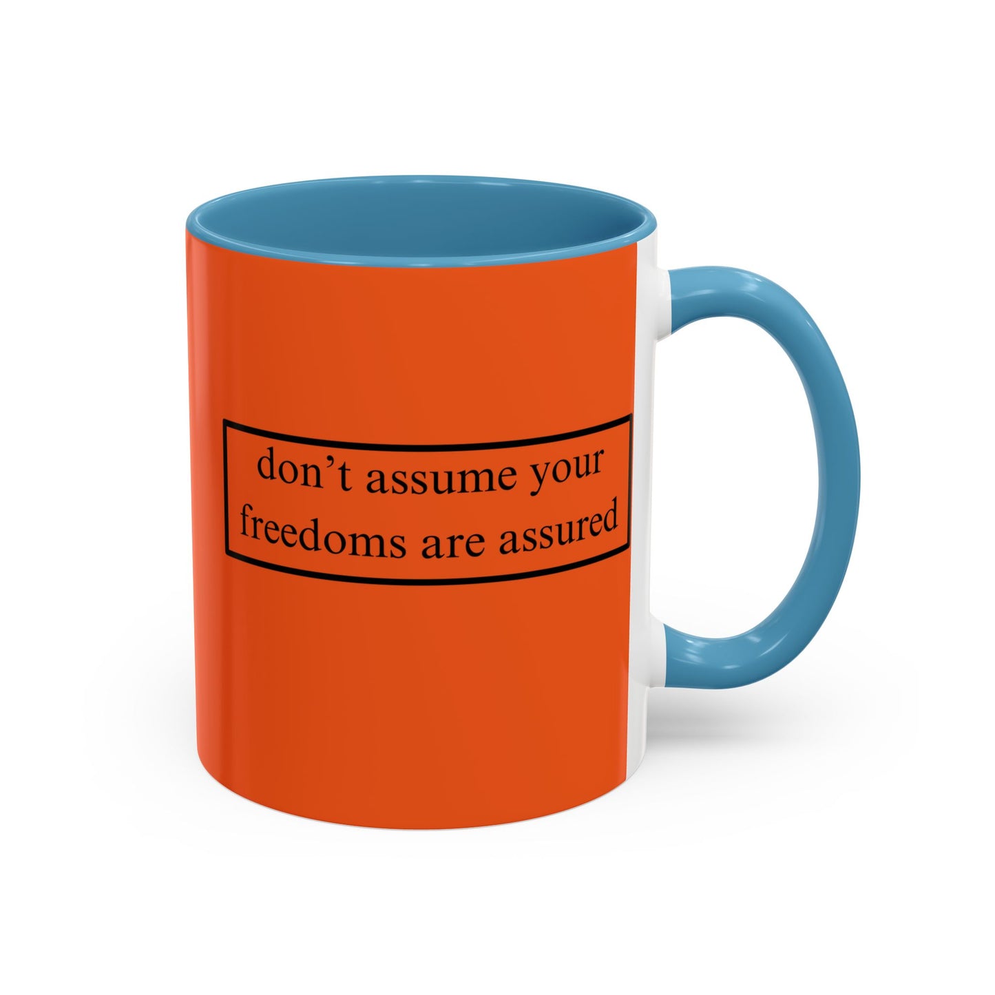 don't assume your freedoms are assured Black font Orange Accent Mug by theGreenDragonTavern.shop