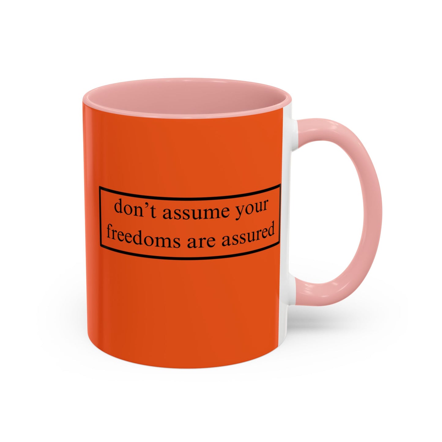 don't assume your freedoms are assured Black font Orange Accent Mug by theGreenDragonTavern.shop
