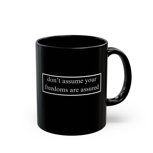 don't assume your freedoms are assured White font Black Mug by theGreenDragonTavern.shop