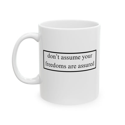 don't assume your freedoms are assured Black font White Mug by theGreenDragonTavern.shop
