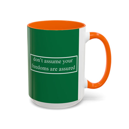 don't assume your freedoms are assured White font Green Accent Mug by theGreenDragonTavern.shop