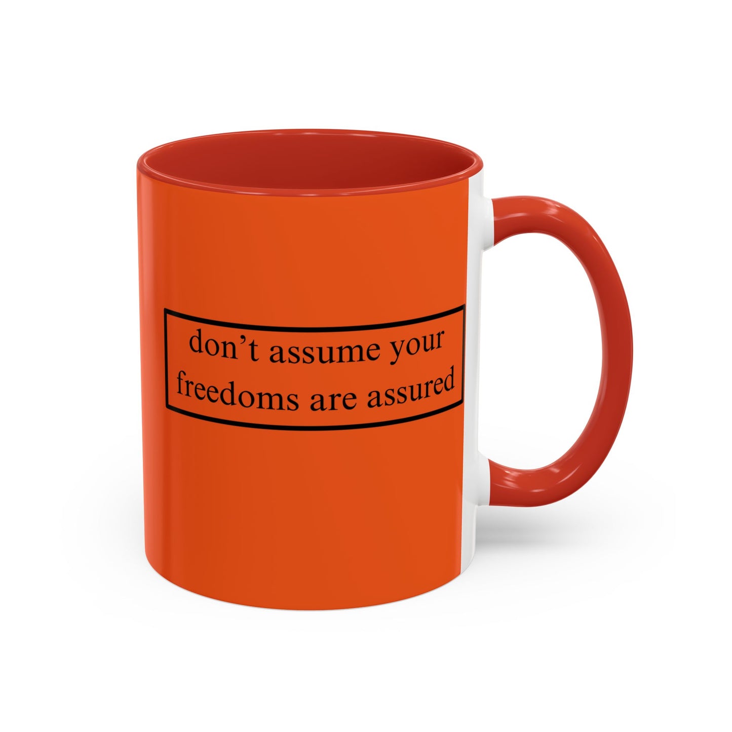 don't assume your freedoms are assured Black font Orange Accent Mug by theGreenDragonTavern.shop
