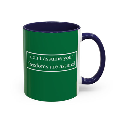 don't assume your freedoms are assured White font Green Accent Mug by theGreenDragonTavern.shop