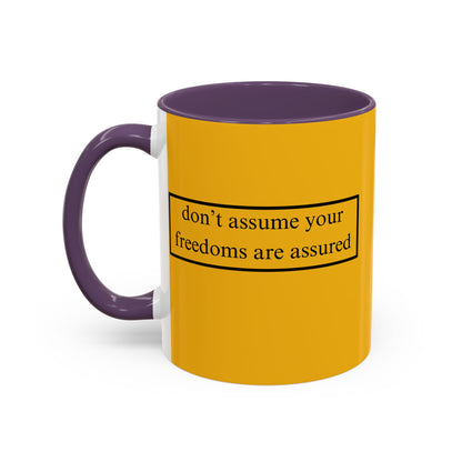 don't assume your freedoms are assured Black font Yellow Accent Mug by theGreenDragonTavern.shop