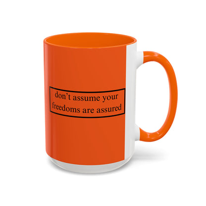 don't assume your freedoms are assured Black font Orange Accent Mug by theGreenDragonTavern.shop