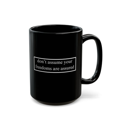don't assume your freedoms are assured White font Black Mug by theGreenDragonTavern.shop