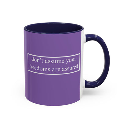 don't assume your freedoms are assured White font Light Purple Accent Mug by theGreenDragonTavern.shop