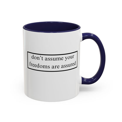 don't assume your freedoms are assured Black font White Accent Mug by theGreenDragonTavern.shop