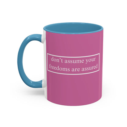 don't assume your freedoms are assured White font Pink Accent Mug by theGreenDragonTavern.shop