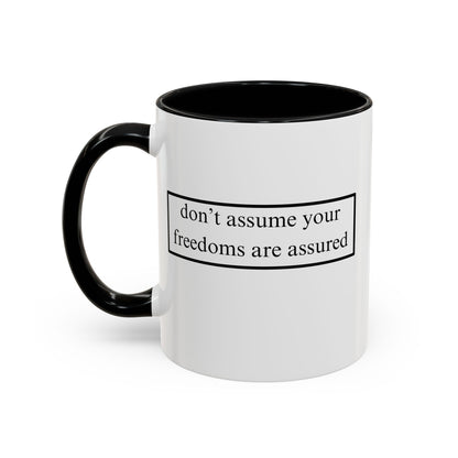don't assume your freedoms are assured Black font White Accent Mug by theGreenDragonTavern.shop